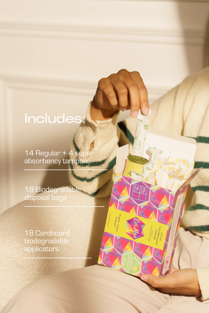 Person holding a package of organic evi mae tampons with product details overlaid