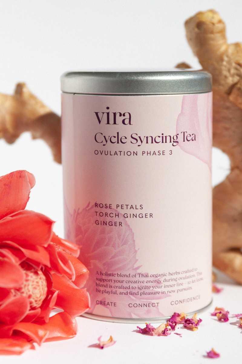 Vira Cycle Syncing Tea ovulation canister with flowers and ginger on a light background